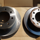 New vs old front brake rotors. Note the lip on the outer circumference of the old rotor.